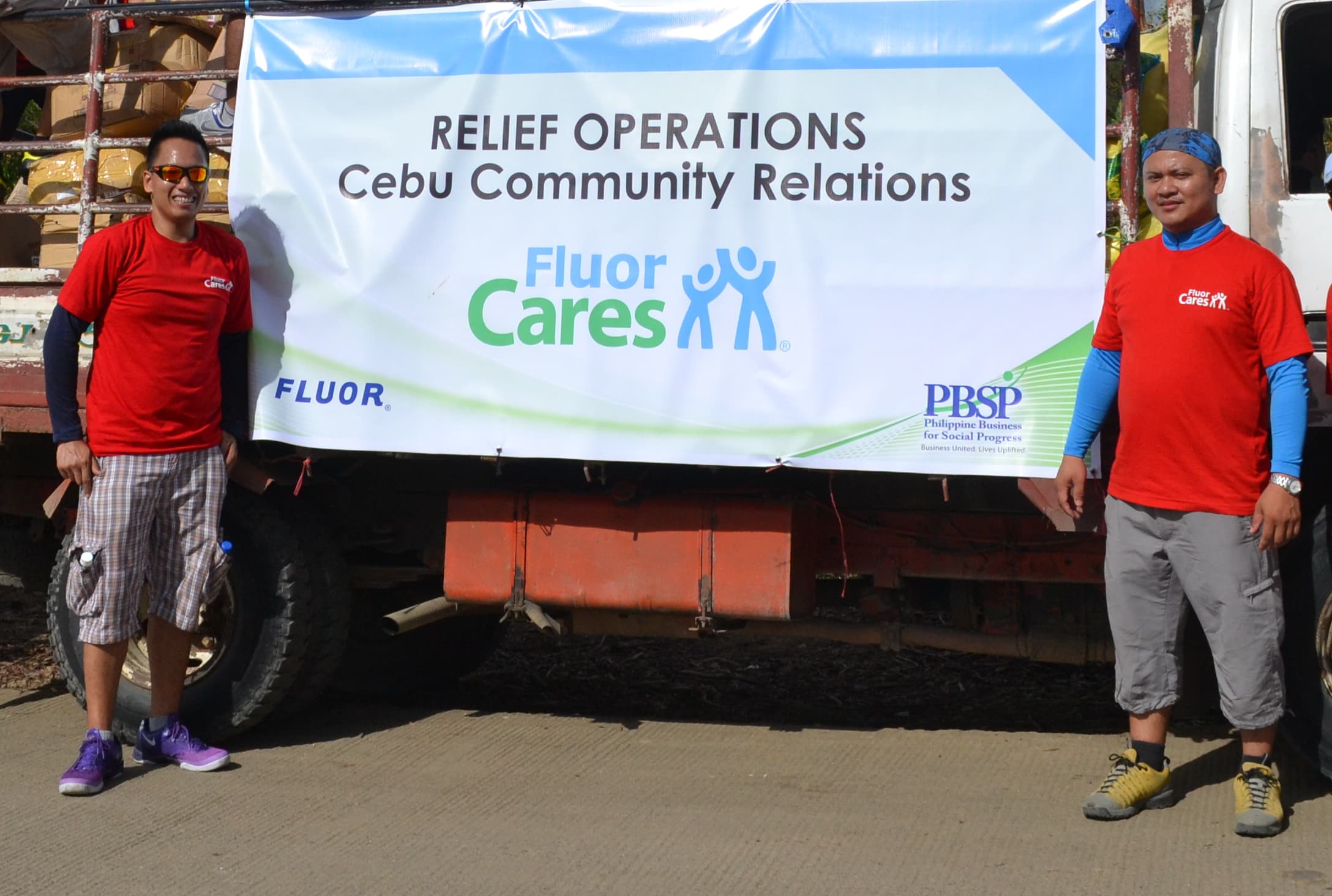 Photo of two Fluor employees volunteering for hurricane relief