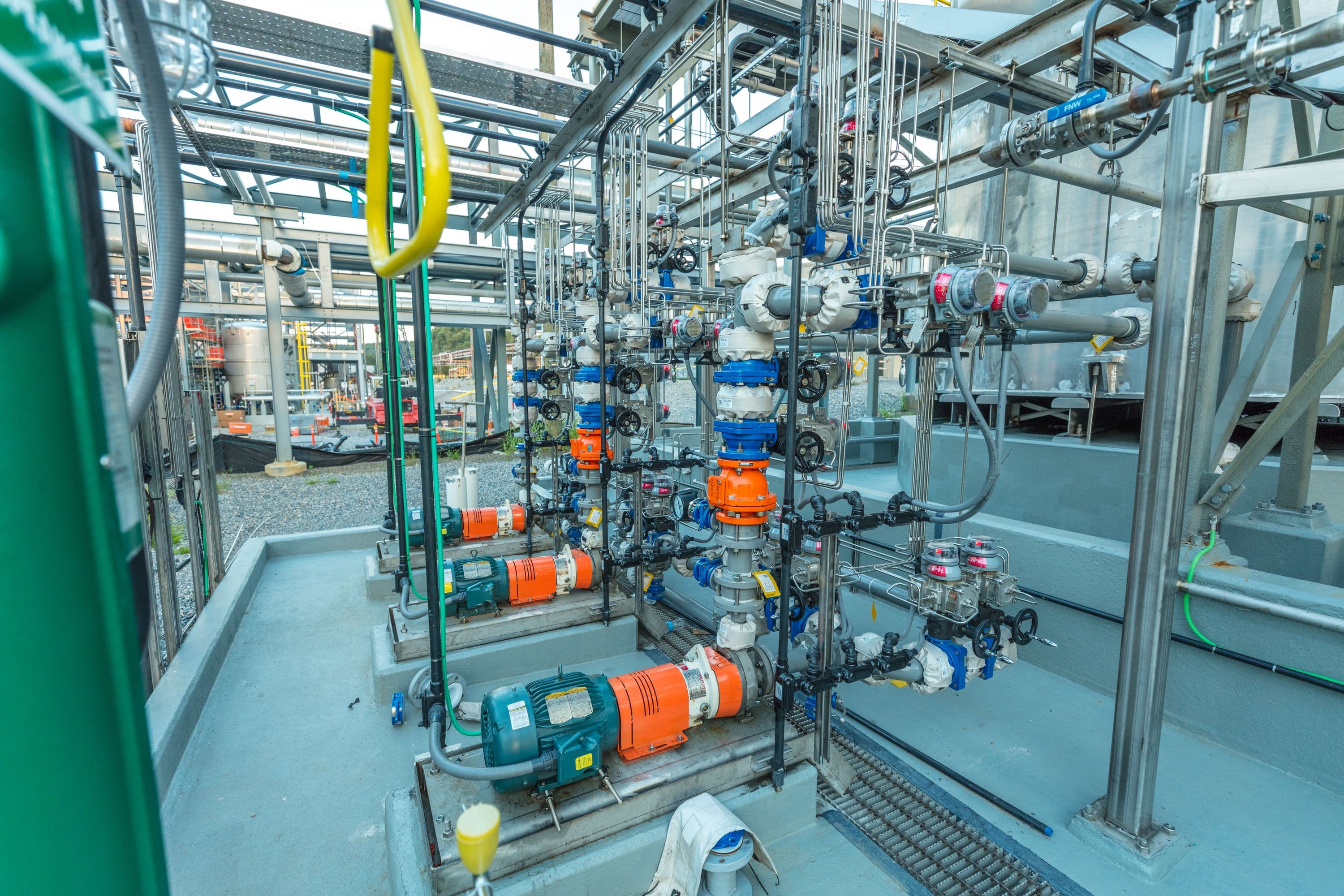 Acid tank farm pump and piping installation